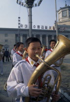Boys in Juche band playing brass instruments outside railway station Juche  pronounced /t.ut..e/ in Korean  approximately "joo-cheh"  is the official ideology of North Korea  and informally the polit...