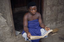 A trakosi fetish slave to voodoo priest.  Virgin girls are given to village priests as a way of appeasing the gods for crimes committed by family members.vestal virgin