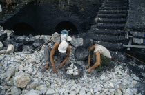 Men selecting rocks for lime kiln