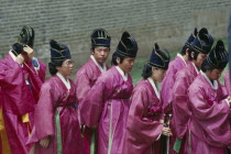 Court musician and dancers in line entering memorial site containing spirit tablet of Yin DynastyKings honoured on 1st Sunday in May