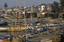 Moored fishing boats and waterfront buildings.West Africa