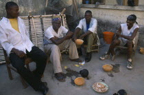 Boys drinking pito  an alcoholic beverage made from millet or sorghum malt and commonly drunk from shared bowls. West Africa