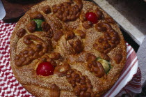 Easter bread decorated with painted hard boiled eggs and sesame seeds to be eaten on Easter Sunday.Holy Week