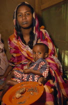 Woman and child displaced by war.