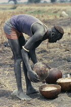 Preparation of millet porridge for Dinka wedding feast.