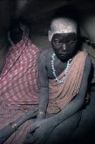 Dinka bride in hut after pre-wedding abduction.