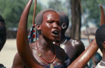 Dinka girl with red painted face at festival celebrating the return of cattle herds to the Toich or pastureland from swamps.