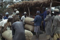 Traders with sacks at groundnuts buying station