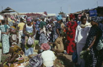Women at market wearing brightly coloured clothes Colored