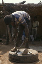 Man mending tyre puncture