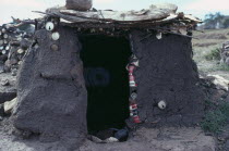 Hut made from mud and tin cans