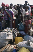 Camp for Sierra Leonean Refugees. People with sacks moving camp