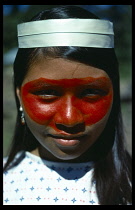 Portrait of Auca Indian girl from Christian group with her face decorated with red Achote paint.