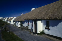 Row of white thatched cottagesEire Republic Ireland Eire Republic Ireland Eire Republic Ireland Eire Republic Ireland Eire Republic Ireland