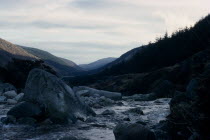 Wicklow Mountains in winter with rocks in river in the foreground under fine covering of snow.Eire Republic Eire Republic Eire Republic Eire Republic Eire Republic
