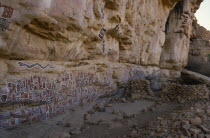 Dogon rock paintings at sacred site of circumcision rituals which take place every three years.  Each new initiate adds his own personal symbol.