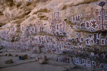 Dogon rock paintings at sacred site of circumcision rituals which take place every three years.  Each new initiate adds his own personal symbol.