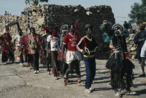 Dogon funeral dance.  Dancers wear masks depicting mythical animals and believe their spirits enter them.