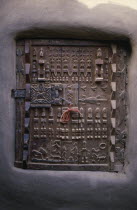 Detail of carved granary door.