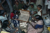 Woman doctor dispensing traditional Ayurvedic medicines at clinic.  Herbal medicine is combined with massage  manipulation  and advice on diet and lifestyle.