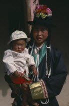 Tu minority Tibetan Buddhist mother and daughter.