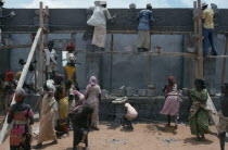 Settled nomads building houses.