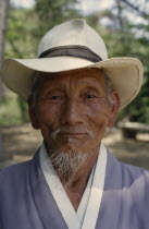 Portrait of grandfather wearing hat.  Male