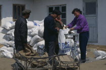 WFP rice distribution to farmers affected by flooding.World Food Programme  Aid