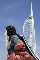 The Spinnaker Tower the tallest public viewing platforn in the UK at 170 metres on Gunwharf Quay with old ships bowsprit figurehead in the foreground