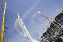 The Spinnaker Tower the tallest public viewing platforn in the UK at 170 metres on Gunwharf Quay with yachts mast in the foreground