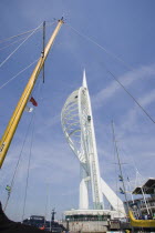 The Spinnaker Tower the tallest public viewing platforn in the UK at 170 metres on Gunwharf Quay with yachts mast in the foreground