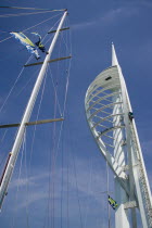 The Spinnaker Tower the tallest public viewing platforn in the UK at 170 metres on Gunwharf Quay with yachts mast in the foreground