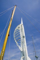 The Spinnaker Tower the tallest public viewing platforn in the UK at 170 metres on Gunwharf Quay with a yachts mast in the foreground