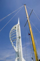 The Spinnaker Tower the tallest public viewing platforn in the UK at 170 metres on Gunwharf Quay with a yachts mast in the foreground