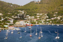 Port Elizabeth with yachts moored in Admiralty Bay with the ferry port and hillside housing beyond