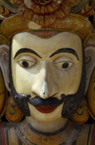Detail of carved and painted figure.