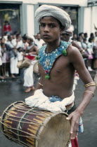 Esala Perahera festival parade drummer.