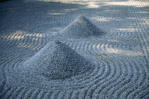 Raked and moulded gravel in Zen garden.