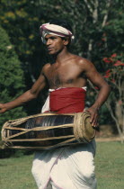 Perahera Buddhist festival.  Traditional drummer.