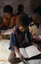 Schoolchildren in area near Mandera devastated by war. African Eastern Africa Kids Learning Lessons Somalian Soomaliya Teaching