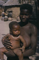 Portrait of young woman and child from village on road between Jos and Bauchi.