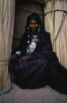 Portrait of Tuareg woman wearing full bridewealth jewellery.Nomadic muslim minority of Berber origin Moslem Colored Coloured