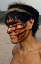Portrait of Shuar Indian man with painted face.