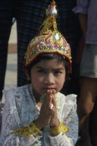 Shwedagon Pagoda.  Young girl in novice monk initiation ceremonyBurma Myanmar  Rangoon Shwe Dagon
