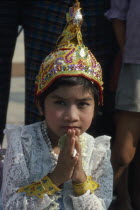 Shwedagon Pagoda.  Young girl in novice monk initiation ceremonyBurma Myanmar  Rangoon Shwe Dagon
