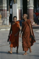 Shwedagon Pagoda.  Two Therevada Buddhist monks.Burma Myanmar  Yangon Rangoon Shwe Dagon
