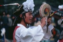 Farmers Dance.  Dancer performing fast Chwado-Ko with ribbons on head-dress creating patterns in the air