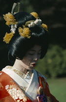 Shinto wedding with bride in traditional dress and elaborate hairstyle