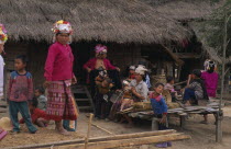 Akha hilltribe women and children outside hut