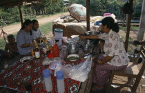 Two girls eating at Mrs Tongs roadside noodle stall